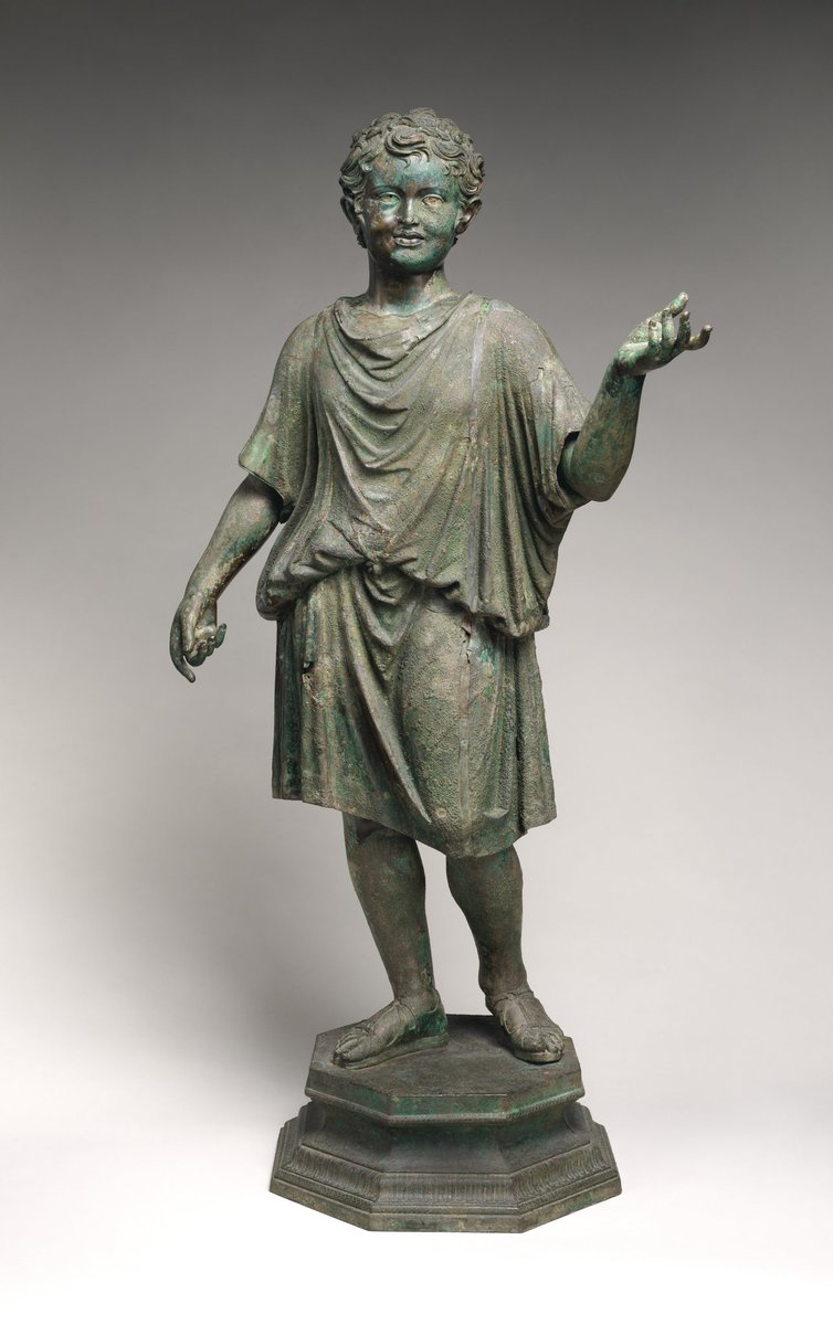 Bronze statue of a camillus, a young attendant (acolyte) at Roman cult sacrifices. He likely held ritual objects like a container for incense in his left hand and a jug for wine. Early Imperial, Julio-Claudian ca. A.D. 14–54 at Met.