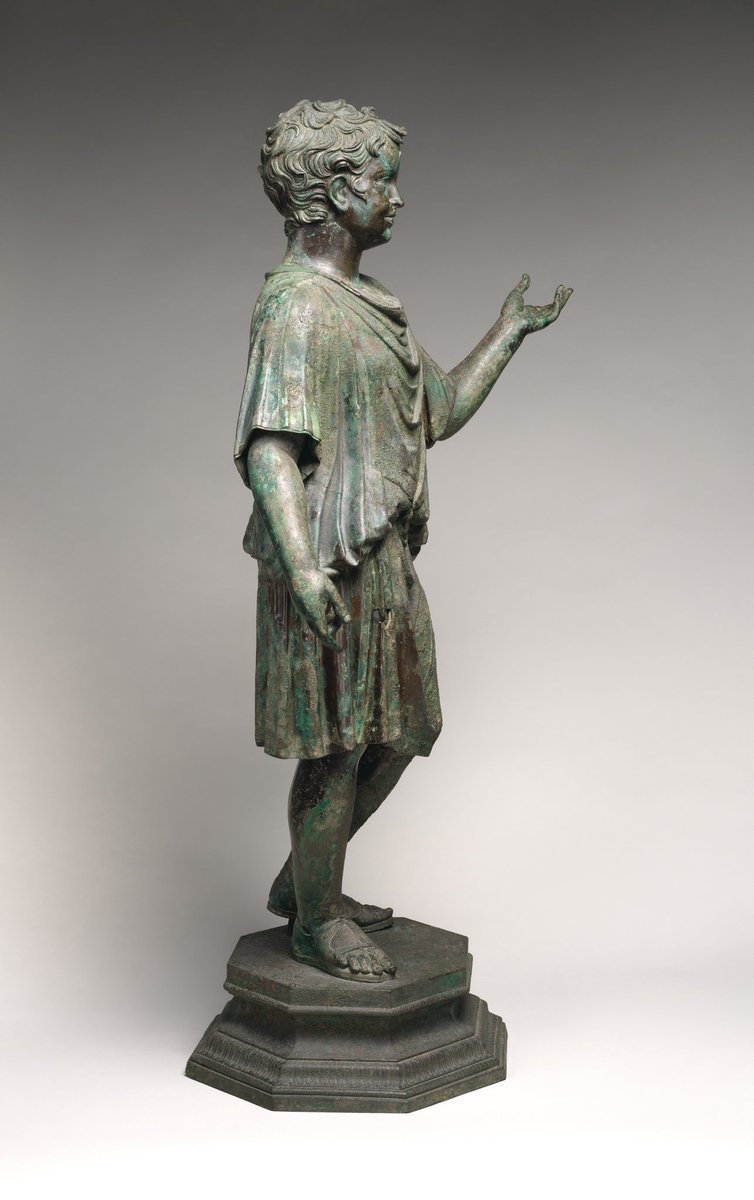 Bronze statue of a camillus, a young attendant (acolyte) at Roman cult sacrifices. He likely held ritual objects like a container for incense in his left hand and a jug for wine. Early Imperial, Julio-Claudian ca. A.D. 14–54 at Met.