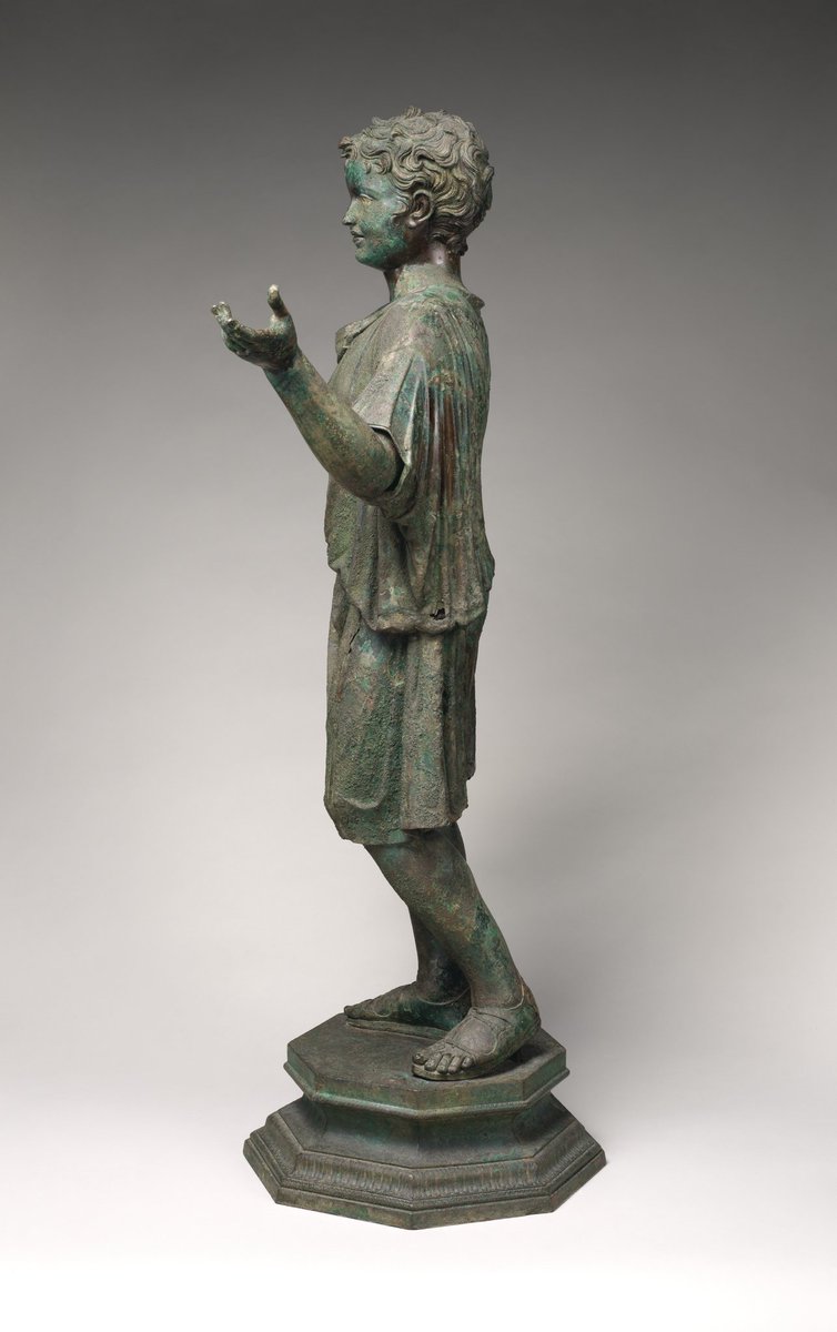 Bronze statue of a camillus, a young attendant (acolyte) at Roman cult sacrifices. He likely held ritual objects like a container for incense in his left hand and a jug for wine. Early Imperial, Julio-Claudian ca. A.D. 14–54 at Met.