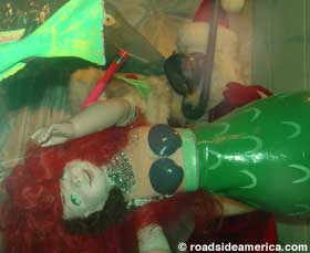 Is that Santa checking out a drunk mermaid? indeed!