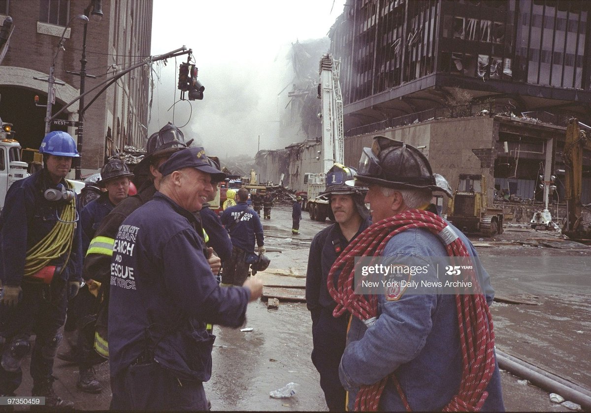 EricReygers's tweet image. SEPTEMBER 14: Ret. FDNY Capt. Jimmy Ellson greets Retired Lt. Paul Geidel (L) and is son Mike (C) as they wait for word of the Lt's other son Garry who is missing. All are from RES1CUE.