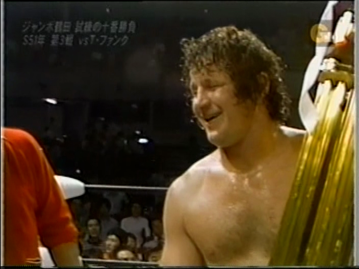After the match Funk gets a giant trophy, but since this is Japan instead of smashing it over Jumbo's head he just raises his hand in mutual respect.