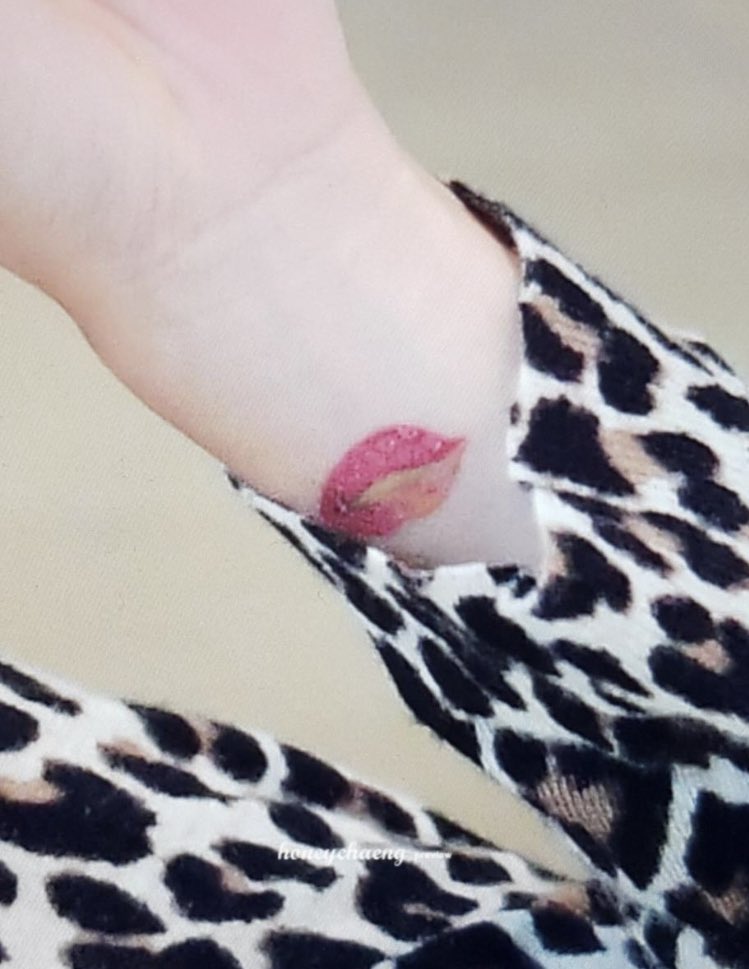 Her lip tattoo