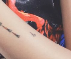 This tattoo which I’m not really sure about?kinda looks like a music note