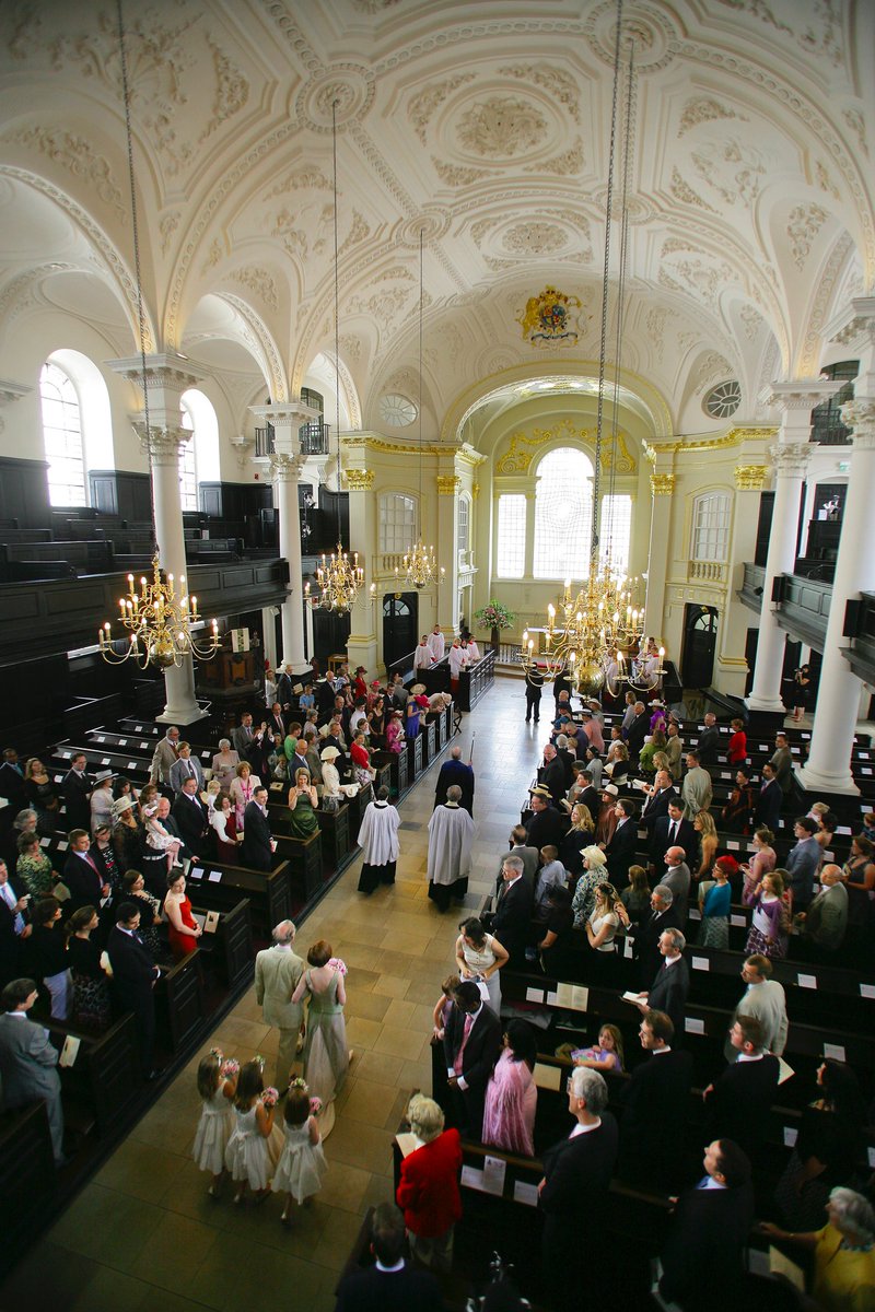 Since I'm here, here's a fine photo of my wedding in July 2008 at this lovely church. Note Ralph the Verger in action in front of the two priests.