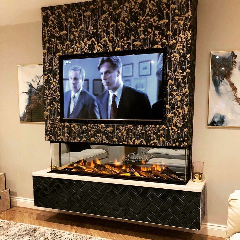 Throwback to one of our favourite ever installations 👌 That is how it’s done! Our e1500gf3 installed onto a floating base with TV recess. Stunning. @evonicfires @heatlandstovesltd #fireplace #floating #interiordesigner #moderndecor #livingroomdesign #electricfireplace