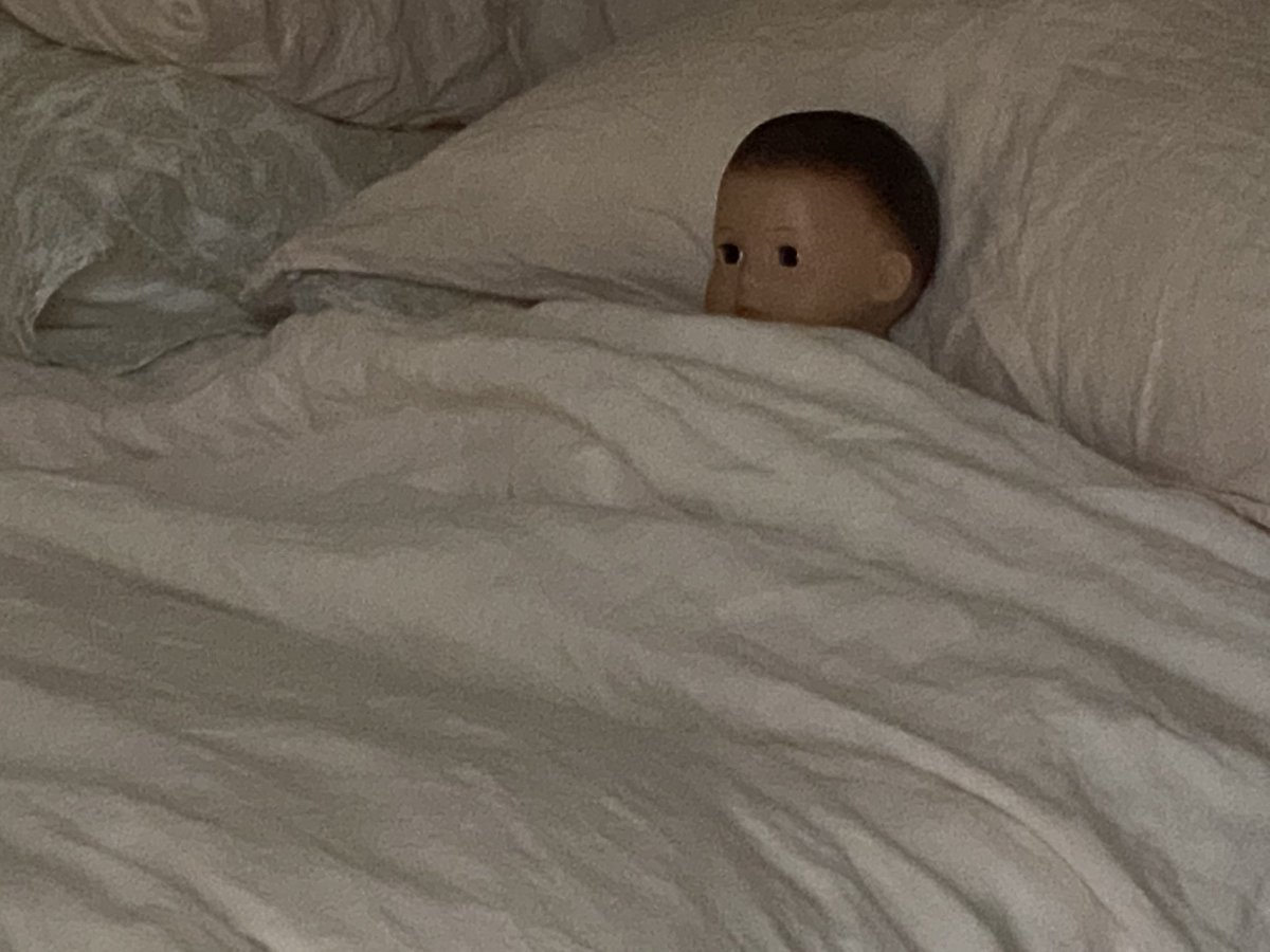 Casey's tweet photo. the girls have been putting their dolls to sleep in my bed.   scares me. https://t.co/EmQWFekXnd