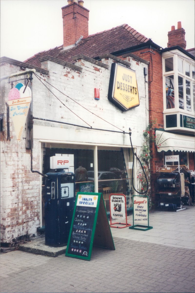 Day 117 of  #petrolstationsRP (Roberts Petroleum)Just Desserts, Woodhall Spa, Lincolnshire, 1999  https://www.flickr.com/photos/danlockton/16264207205/  https://www.flickr.com/photos/danlockton/16264207245/An ice cream parlour in a former garage, with two 1960s Avery Hardoll pumps outside. Now Woodlands Café  https://www.flickr.com/photos/danlockton/16264207245/