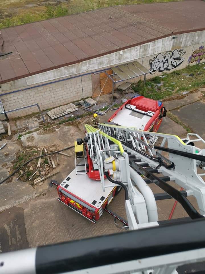 WarksFireRescue's tweet photo. Yesterday our crews were called to the former Brandon Stadium along with a fire appliance from @WestMidsFire On arrival crews found a well developed fire in the main stand of the building. Crews worked quickly to tackle the fire and reduce the smoke plume. #Brandonspeedway https://t.co/ZGclQ6oqBy