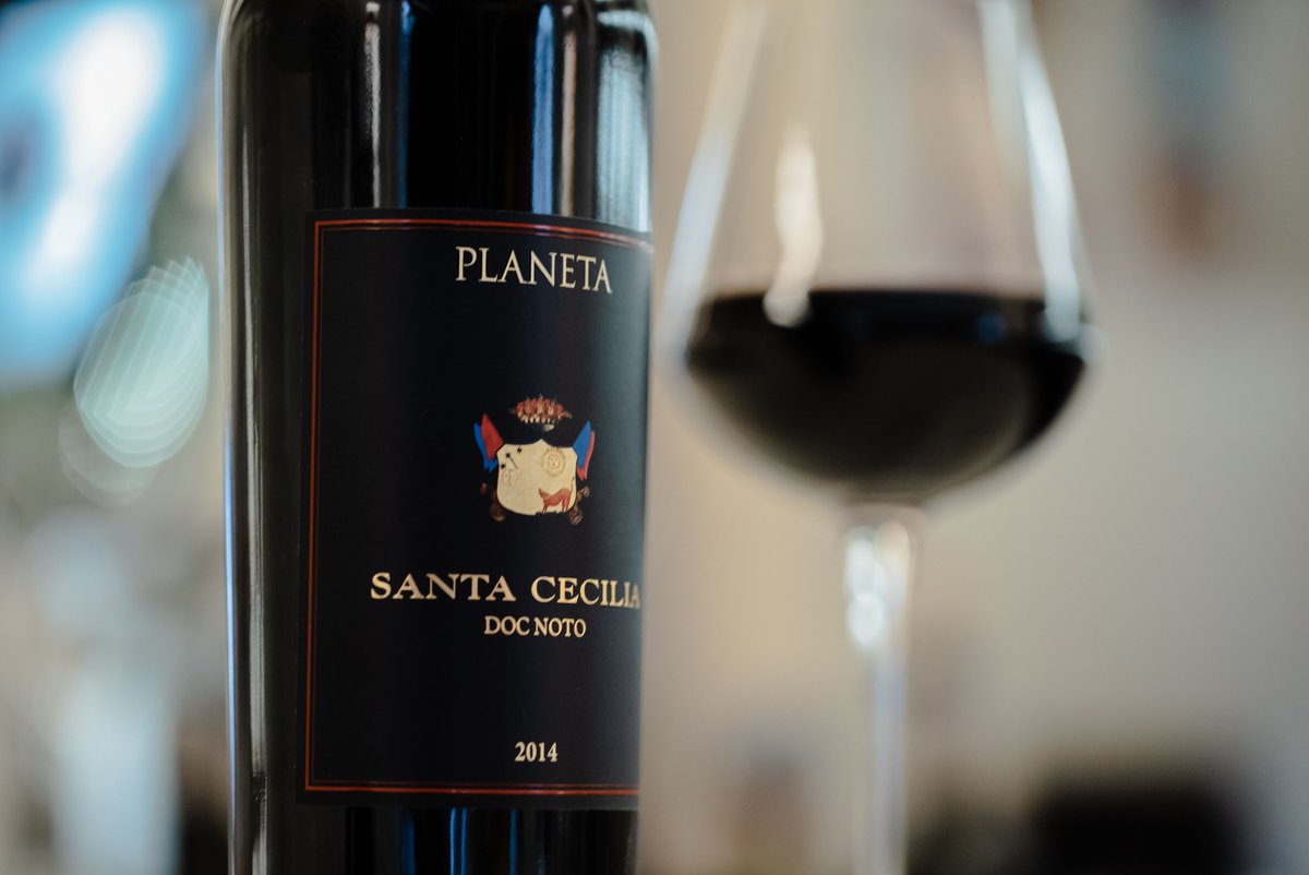 Love bold red Sicilian wines? You’ll love the Santa Cecilia Noto DOC, by our friends at <a href="/PlanetaWinery/">Planeta Winery</a>! Santa Cecilia is a very spicy fruity wine, brilliant and clear, perfumed with carob, bergamot and orange peel – a perfect pairing for Anelletti al forno or fish dishes.