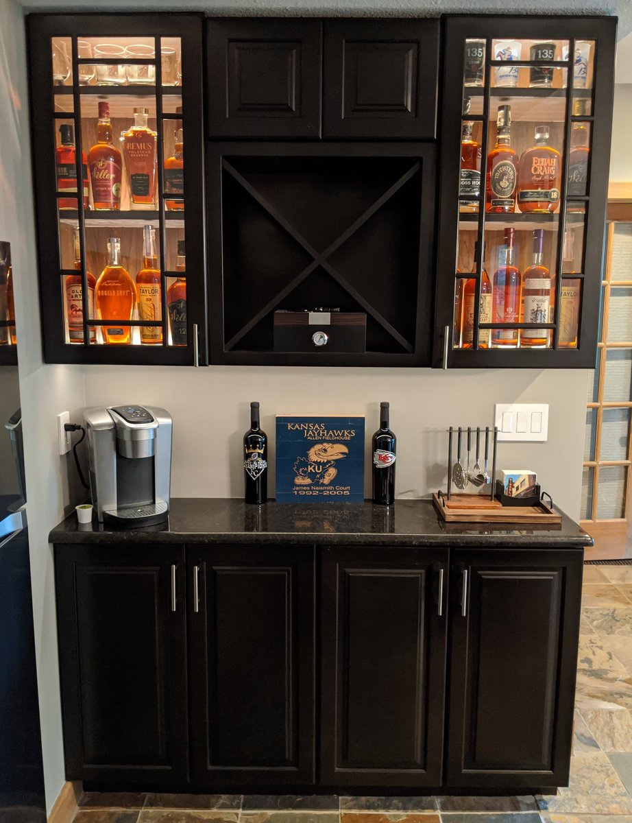 lukeborn's tweet photo. Customer wanted to show off his bourbon collection so he asked for ideas and this is what I came up with.  First time I've up lit a cabinet, hidden by a felt padding.  I think it turned out pretty sharp, what say you? https://t.co/j55uVr8w6z