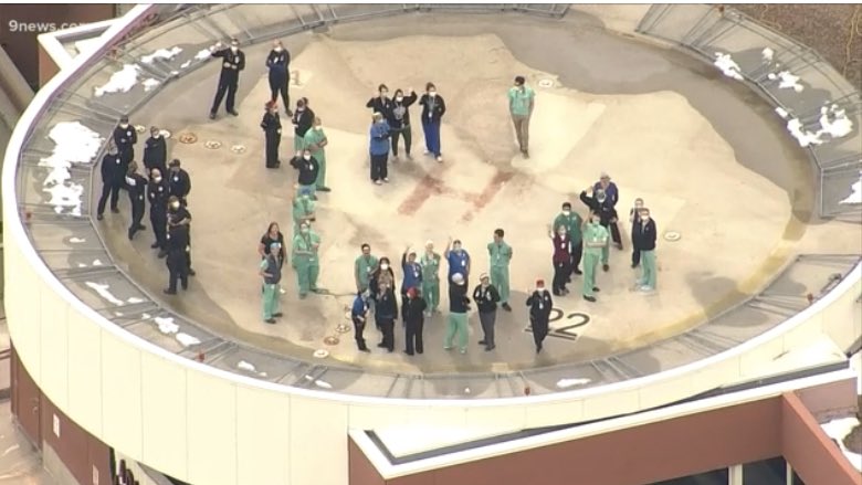 KyleClark's tweet image. Denver Health employees gather on the helipad to watch the Thunderbird flyover in honor of healthcare workers. #9News #COVID19Colorado
