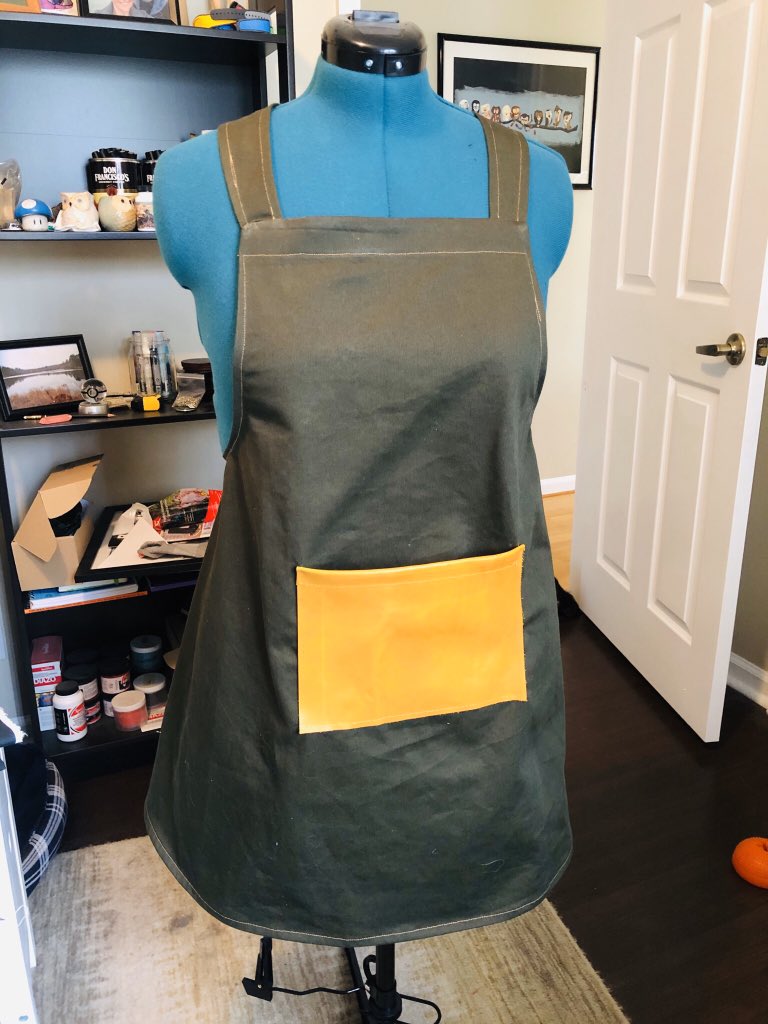 Samizabeth's tweet photo. Completed one of the many projects I set up for myself this weekend! A Garden Apron! Main green material is leftover fabric from my Coat Project, leather is from som scraps I got at @blickartmaterials a few months ago, contrasting thread becauseI’m out of green thread! 
#sewing https://t.co/ZNAFYxKdEm