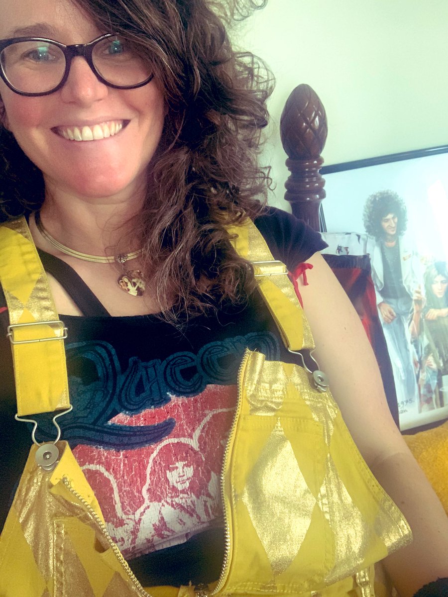 amedawg18's tweet photo. Not nearly as awesome as being at @bufferingcast prom with @marinapcatala, but enjoying the #TheProm live watch (while monitoring an all-day friend birthday Zoom) nonetheless. Will try to get cat pics, but for now, me in my #HarleyQuinn overalls and #Queen gear. #BuffyProm #BtVS https://t.co/Uxgh8MIxq5