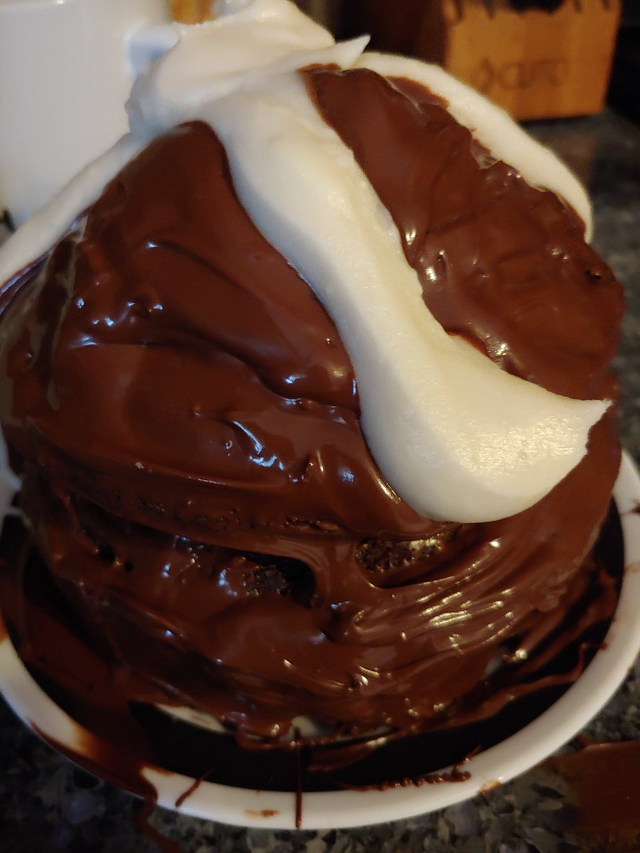 ESPNChristine's tweet photo. My homemade hostess cupcake, compete with squiggle (or it is a blob).  My decorating stinks, but at least I used the cupcake pan I have had for 2 years! https://t.co/se96kxq4NH