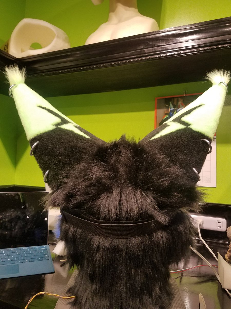 I don't know why I've been so unproductive lately especially with fursuit stuff. Possibly from exhaustion from work. Anyway, I did finally get around to adding more "piercings" to my ears.