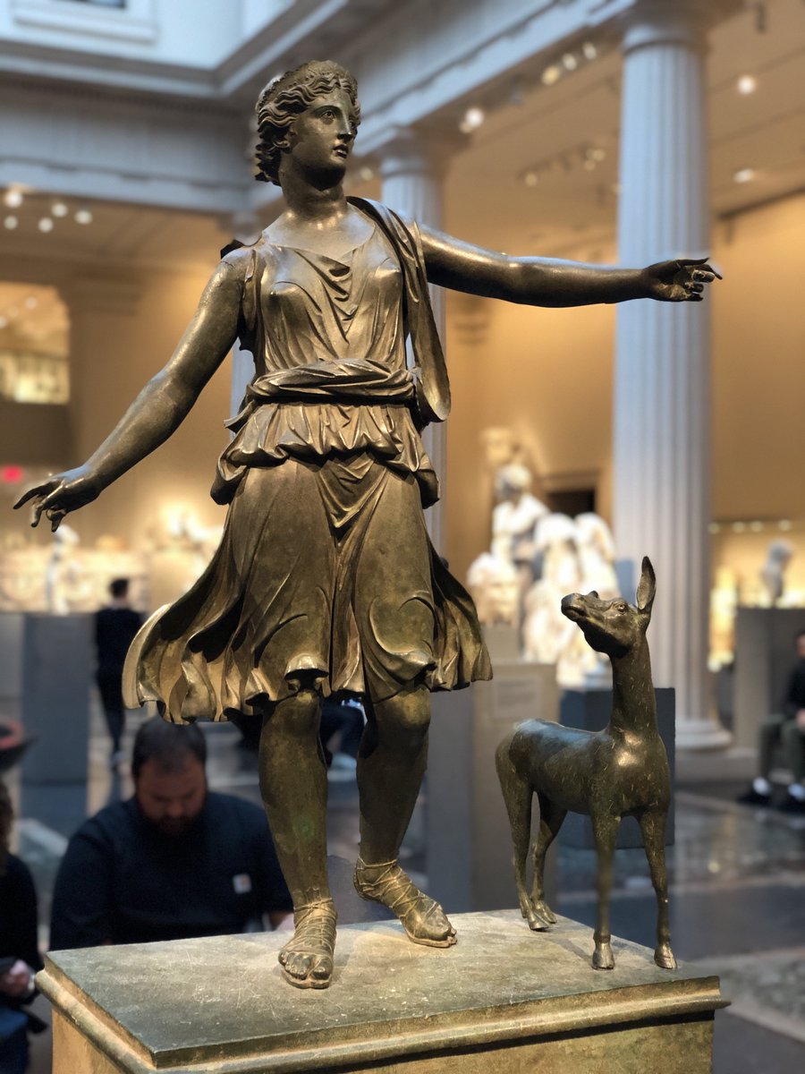 Today is NYC Museums for  #MuseumsUnlocked. Some selections from  @metmuseum. A bronze statue of Artemis and a deer; a tombstone of Publius Sextilius Fortunatus; a polychrome funerary stele w/ two sphinxes; a mummy mask of a woman with real hair and jeweled garland. 1/