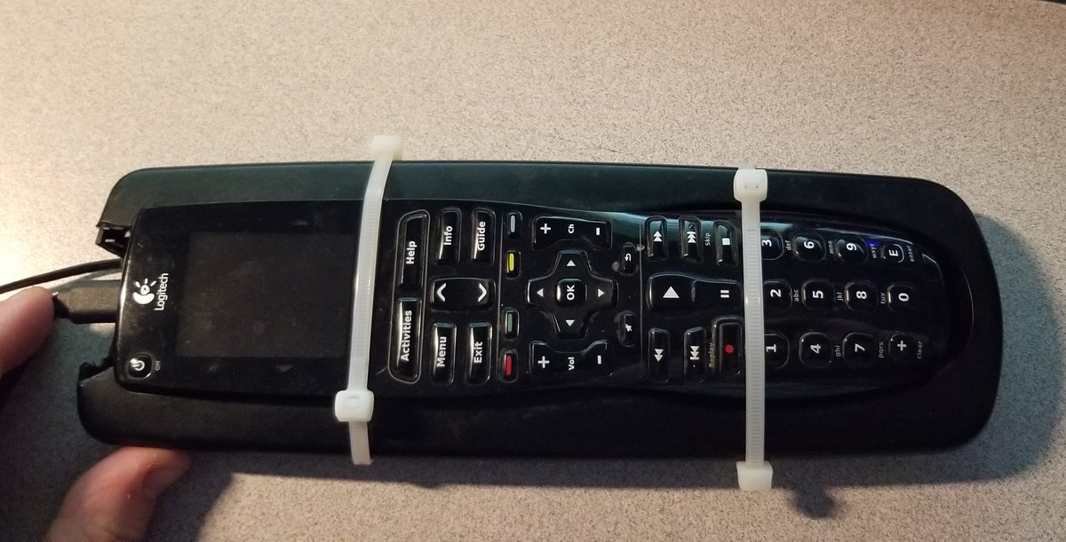 I'll have you know this is a perfectly valid way to secure your remote in the cradle and ensure it stays powered
