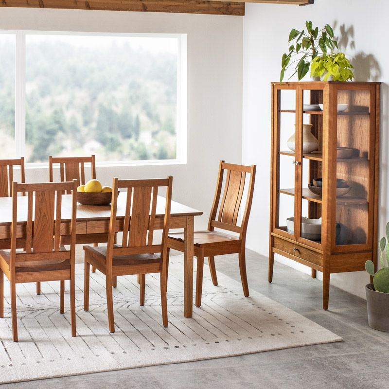 While we are missing the bright natural light of our St. Johns showroom, this recent photo from our photoshoot is a nice reminder. Featuring our Kenton Chairs, Shaker Dining Table, and Whitman Curio in <a href="/CollinsWood1855/">Collins</a> Cherry. ⠀
⠀