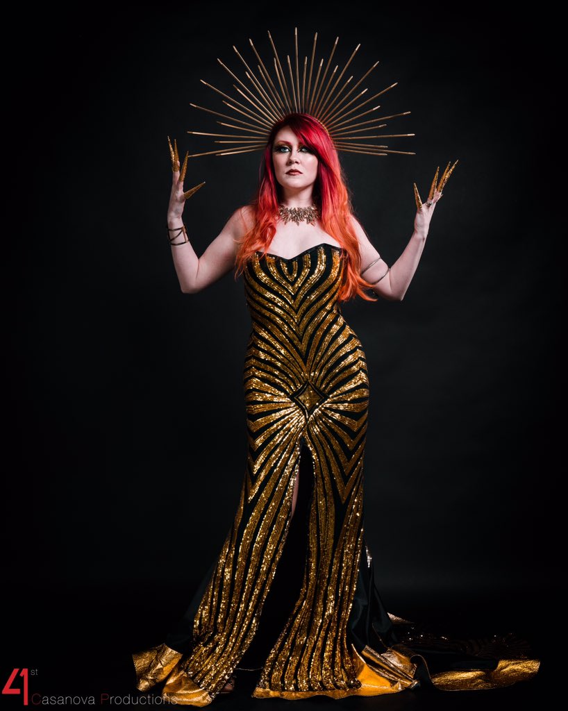 AnariaBand's tweet photo. “The game is set, the pieces are in play; Time to fight, time to even the odds...” (Exile) PC: @41stcasanova Dress: @TheJessicaMercy 
#anaria #egyptianhighfashion #exile2020 #symphonicmetal #symphonicrock #rock #metal #glamor #jessicamercy #golddress #comingsoon https://t.co/0J9bpSV9zT