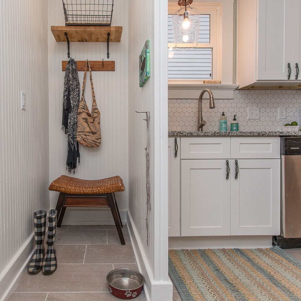 A wall at the end of our kitchen creates a mudroom space perfect for boots and pet dishes.

#smallspacesquad #mudroom #kitchendecor #cottagestyle #farmhousestyle #ApartmentTherapy #decor #hometohave #nestandthrive #makehomematter #howwedwell #myhouzz #mysouthernliving