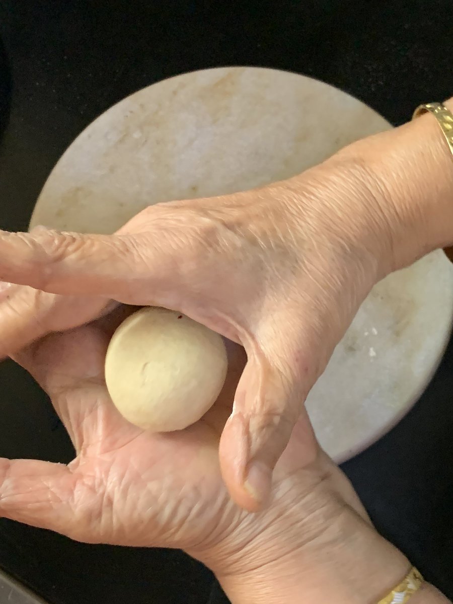 Next step is to make a smooth ball. Roll it in your hands by keeping on one hand using the two fingers of the other to roll.