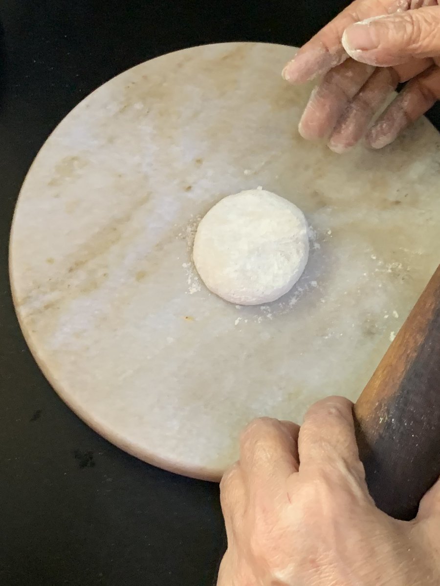 Coat with some dry flour before rolling. Don’t worry about using too much flour. You can dust it off later before you put it on the tawa