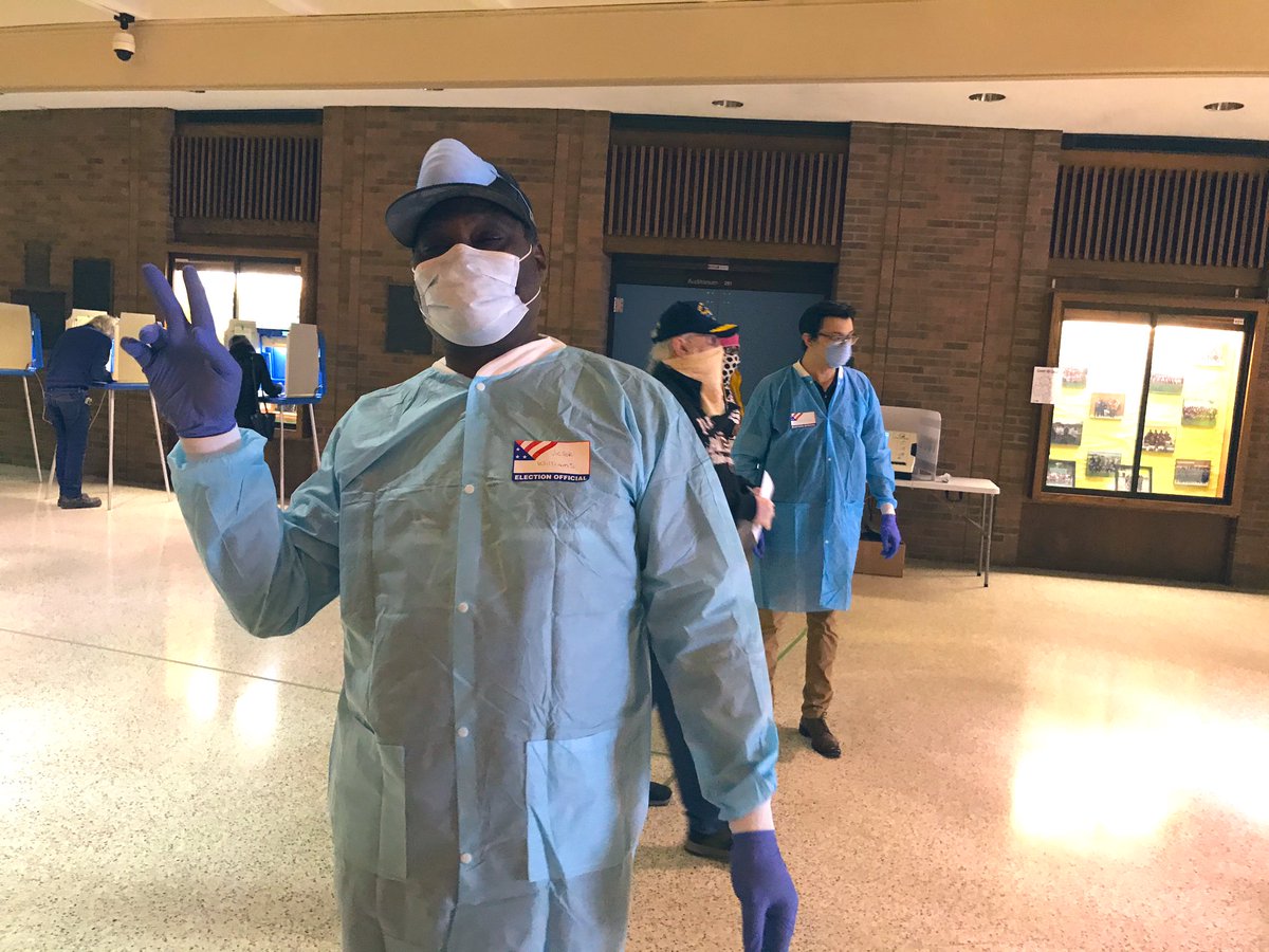 Election officials look more like medical personnel today. Their positive vibes are helping to ease tension at the polling sites. ( @tmj4)  #Wisconsin