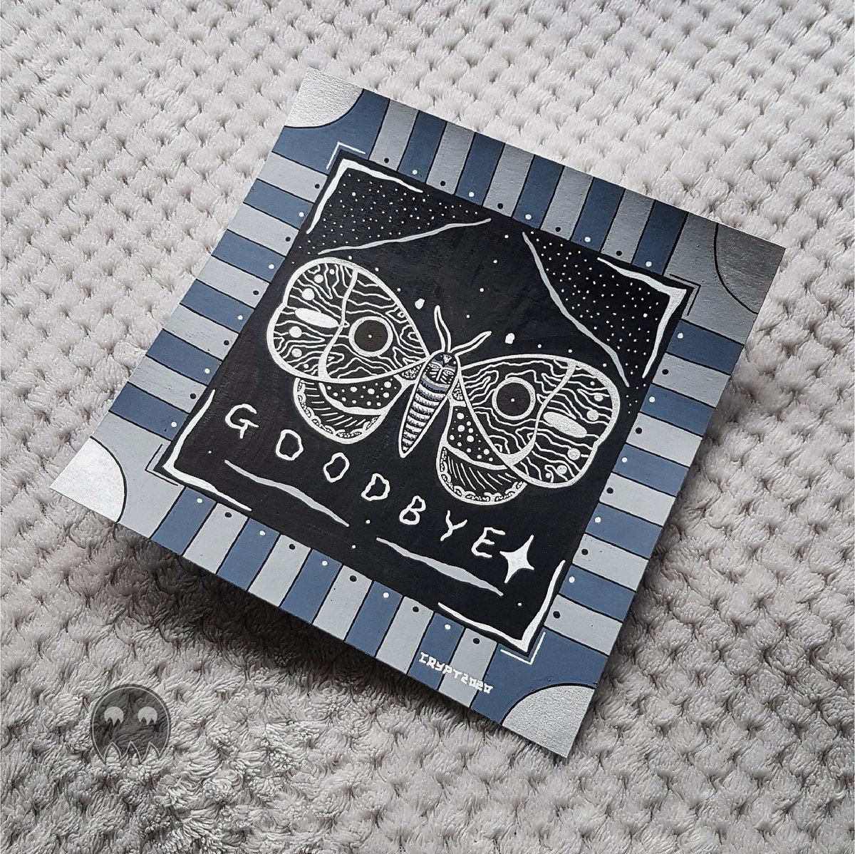 ouija moth, 8x8 inches. posca markers on cass art heavyweight cartridge paperthis one was silver and white on black but the silver doesn't show too well in the picture