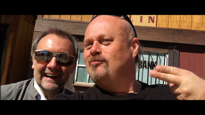 Mercury Vice President and Head of Post-Production Peter White (right) pictured with Head of Production Mr. Terry Bamber (left), discussing the shotlist while walking through Mercury’s Cowboy Town backlot.  #hollywoodstudios #behindthescenes #cowboytown #terrybamber #jamesbond