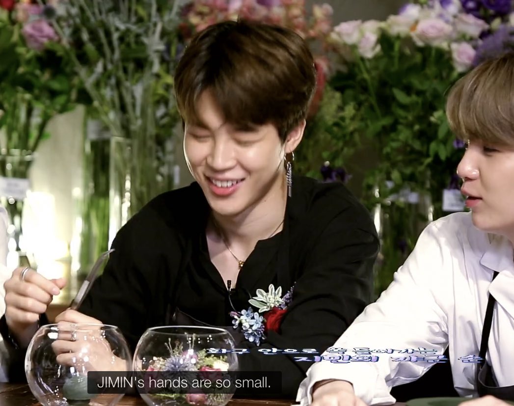 Jimin’s arrangement is in a glass bowl, and The Florist gave him tweezers to use, but Jimin is all “NO NEED, I GOT SMALL HANDS.”