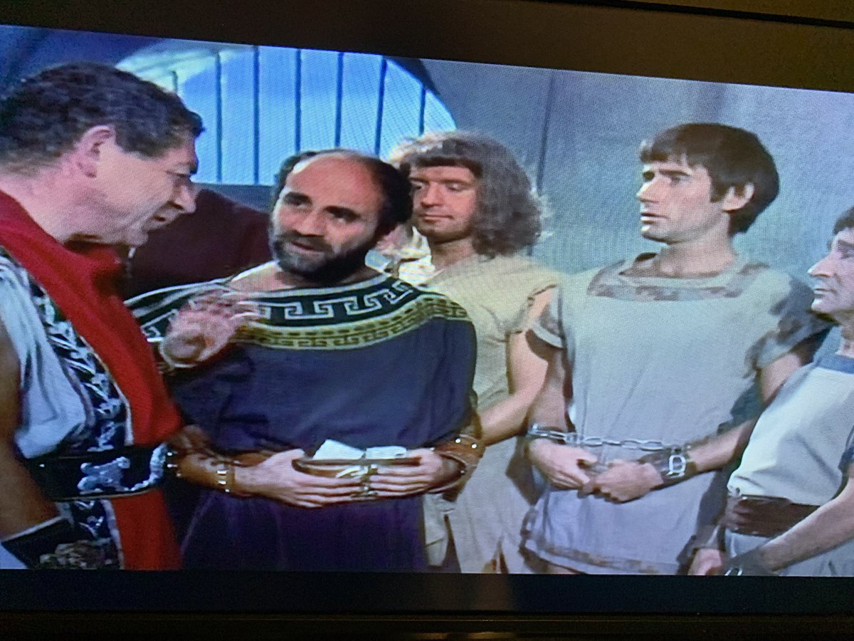 Nice cameo from future Alf Garnett, Warren Mitchell as Spencius of Marcus and Spencius. A crack at Britain’s declining industry as he tells Sid ‘the British don’t make em like they used to’.