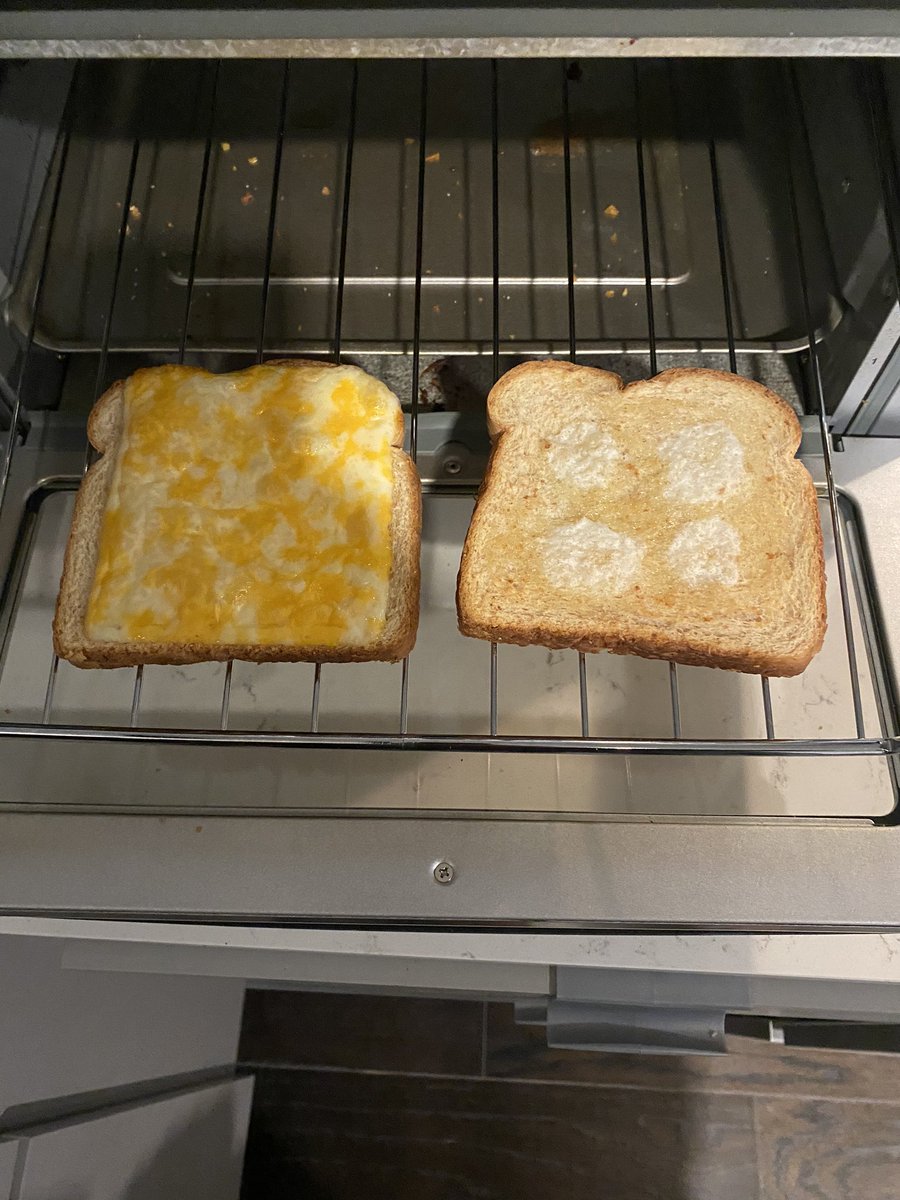 THIRD, once the nuggets were done I placed the bread in on the “light” toaster setting. One piece had cheese on it so it could melt, and on the other piece I put a little bit of butter because it’s my creation and I can do whatever I want.