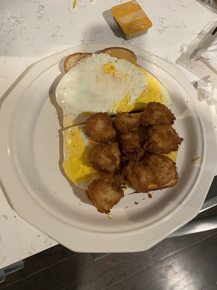 Once the bread was done I was “in business” as they say. All I had left was the assembly. I applied Chick Fil A sauce to both sides, then placed an egg on each side and put the nuggets in the middle.