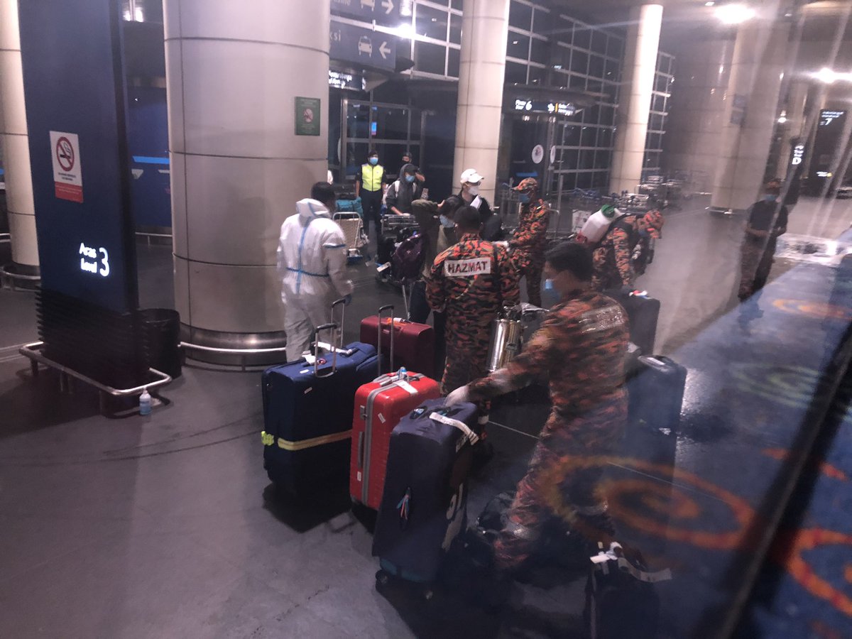 Then, it was time to board the bus. (Kind of intimidating because they had cops with guns on standby) They had a hazmat team (in orange) come and sanitize everyone’s luggages and carry-ons before boarding.