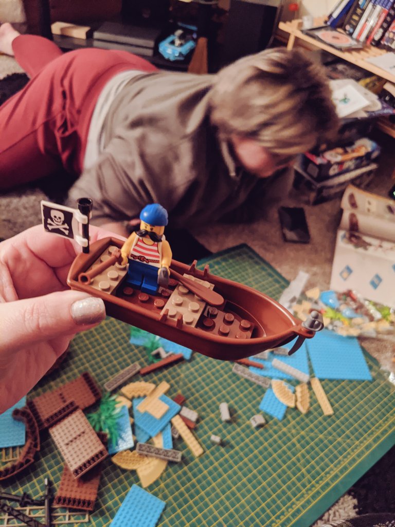 The tiny Lego man has built a tiny Lego boat!Now on to the monster!(Ignore the Tiny Lego Man's assistant in the background. They're not important.)