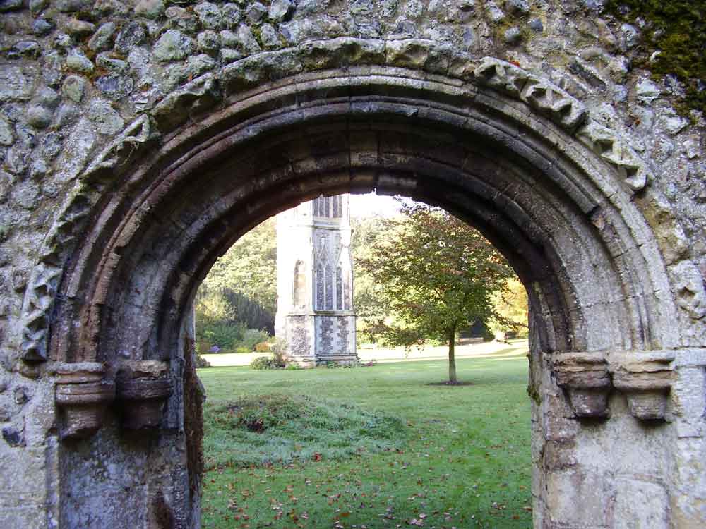 This Romanesque archway was moved from another part of the site, reputedly the infirmary, in the early 19th century and re-erected as a gateway into the well garden. The position of the original Holy House stands beyond the small tree visible through the arch.  #EAchurches