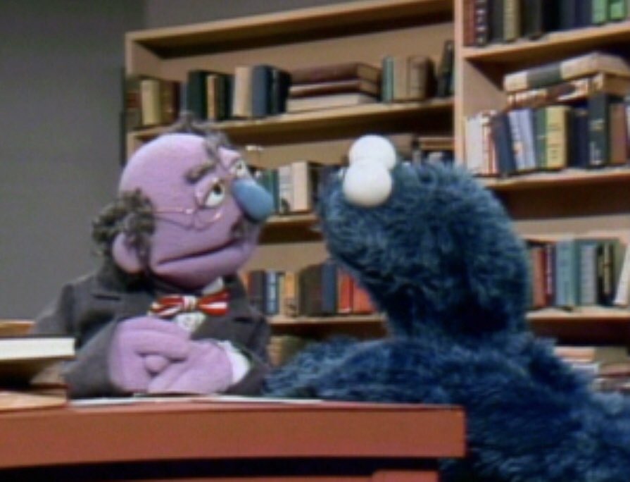 Unknown lavender librarian:- Scolds Cookie Monster for his admiration of the collection- Shushes & doesn’t offer to help after Cookie Monster trips over  - Explains the general idea of the library- Doesn’t consult w/ children’s dept to see if there are any spare  3/10