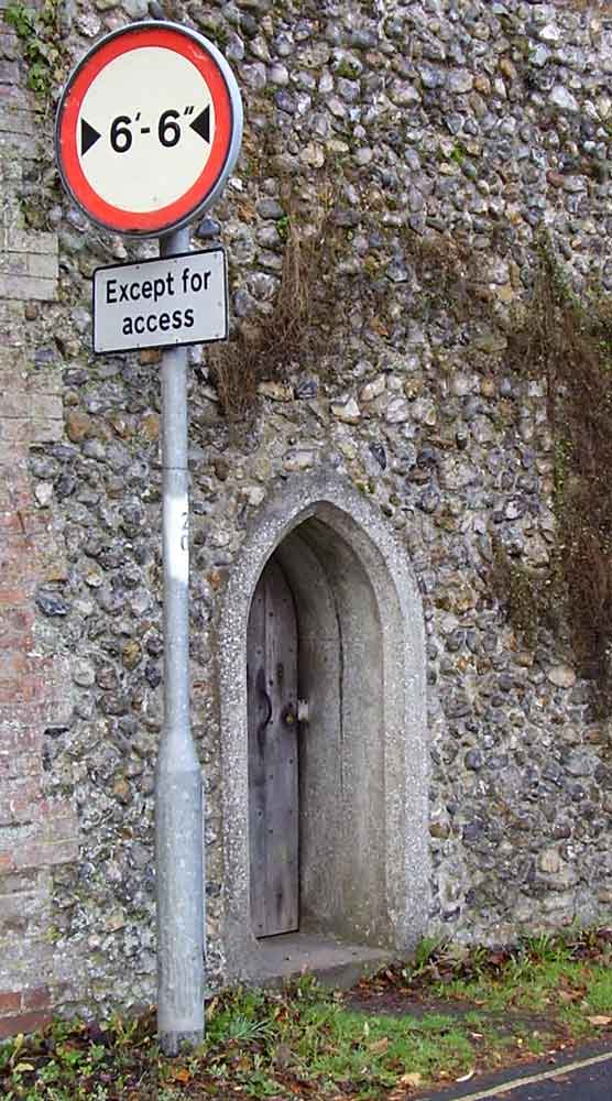 The gate, as can be seen from the photograph, was rebuilt, along with much of the precinct wall, in the 19th century remodelling. However, as the sign makes clear, the new gate is still unsuitable for wide loads.  #EAchurches