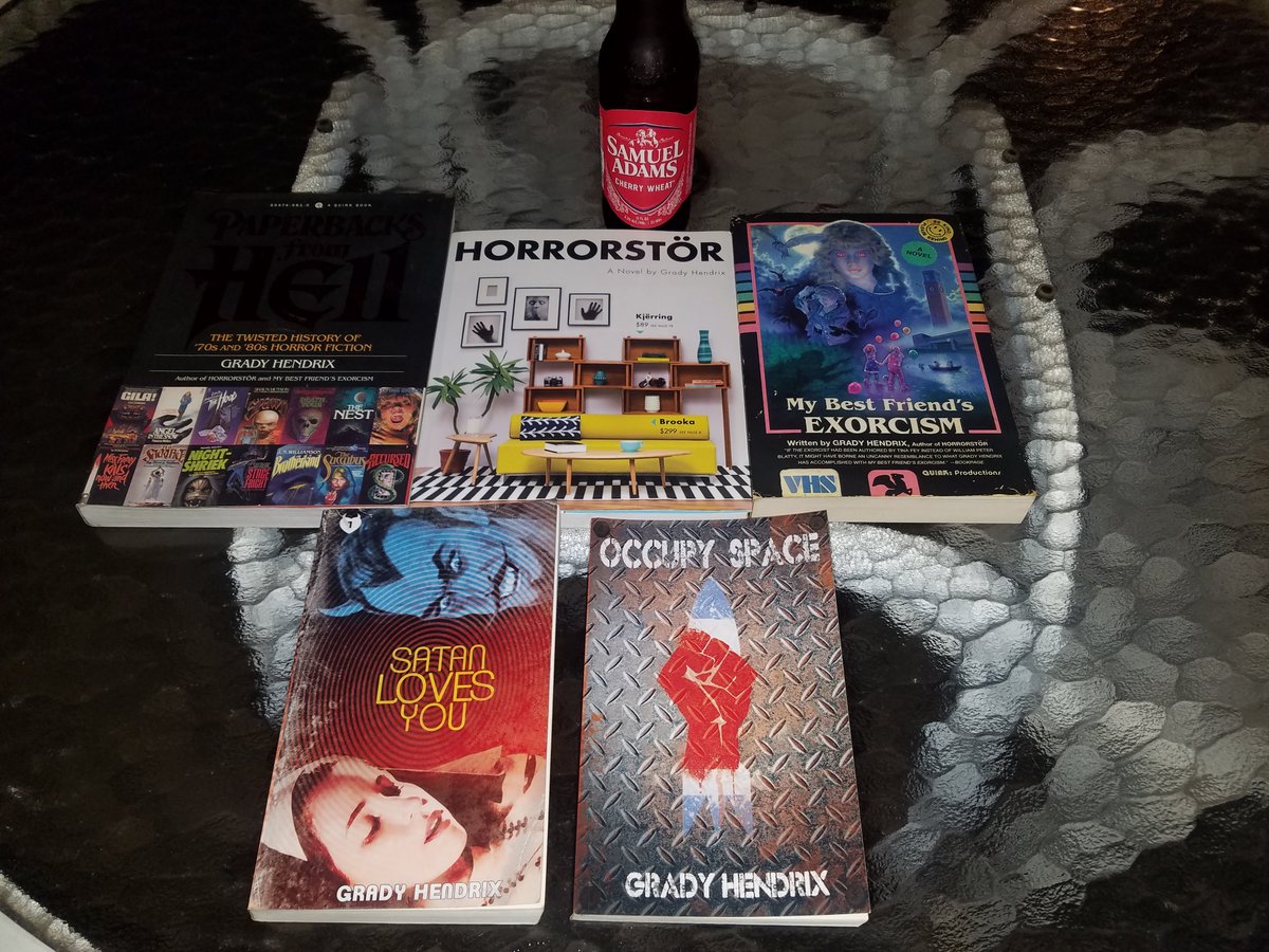 filmauthor1's tweet photo. @grady_hendrix My second toast to #GradyHendrix. Congrats on your book's birthday. My collection of books from a modern master! I don't have The Southern Book Club, yet. But it's en route, and We Sold Our Souls is currently being babysat by a friend and "future fan." Congrats! https://t.co/liBWG2TwCV