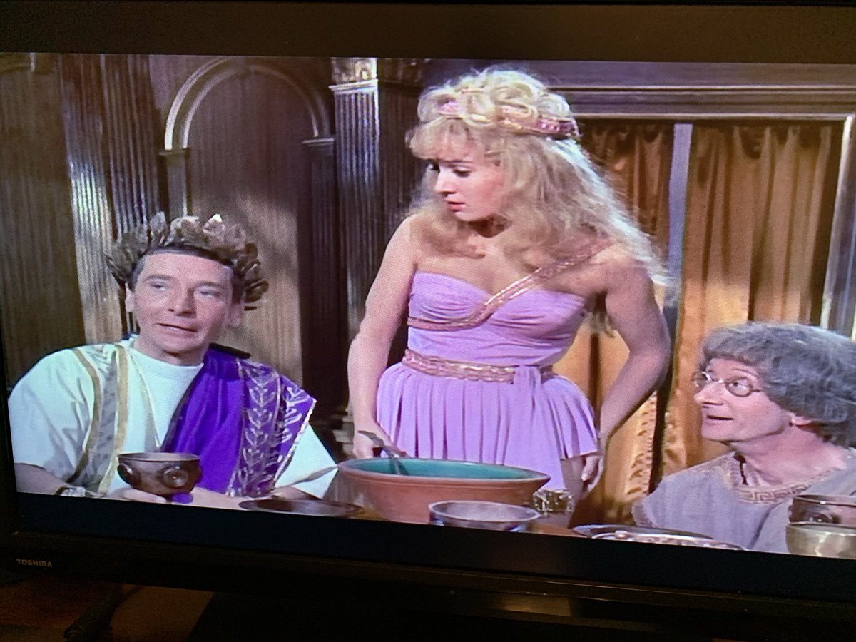 Never noticed this gag in Cleo before. The slave Gloria (who’s also Jim Dale’s ex missus from Bristol) asks Ken W:‘You are not well my Lord!’‘Just a little sick; transit, Gloria.’