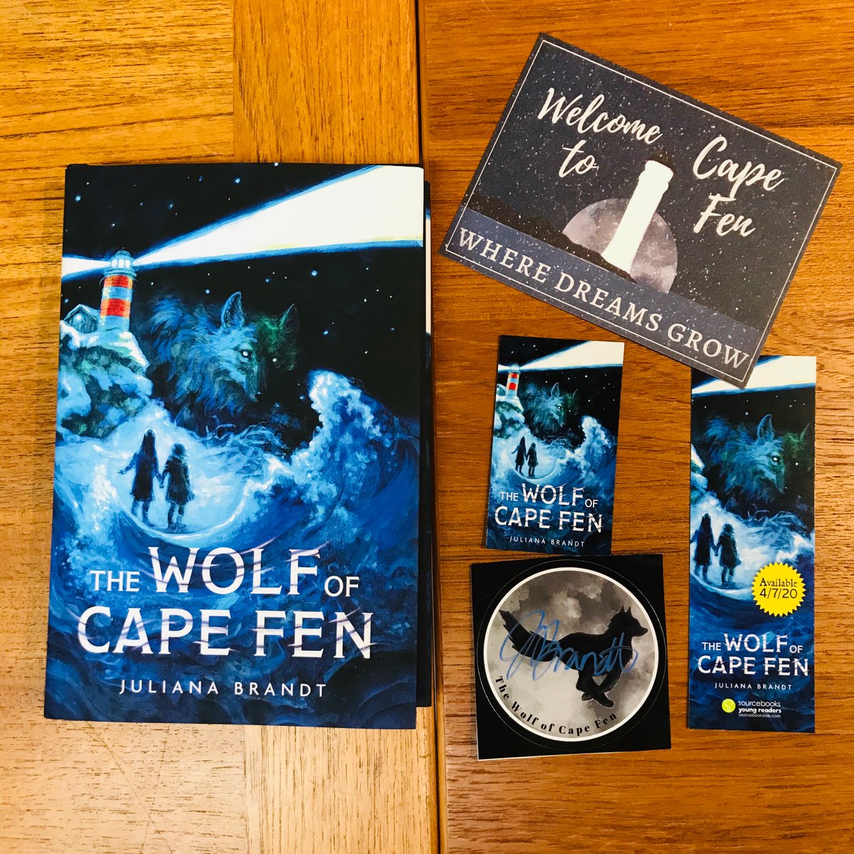 THE WOLF OF CAPE FEN by  @julianalbrandt! We're so bummed not to get to have a real party with Juliana, but her book is beautiful and you can still get a copy with a signed bookplate plus a postcard and bookmark and magnet!