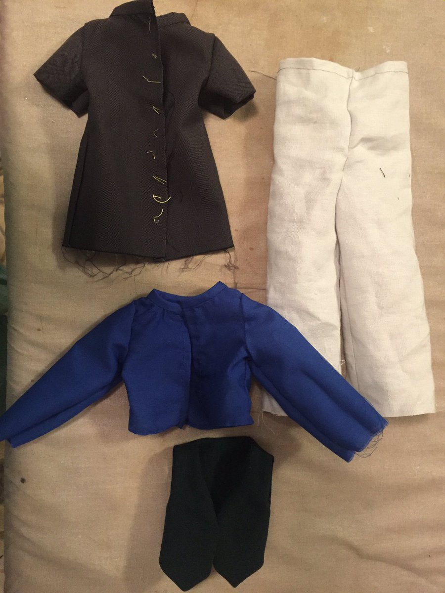 You wanna see the clothes so far? OF COURSE YOU DO. Behold! Joscelin’s coat and pants and Hyacinthe’s shirt and waistcoat! (Hems deliberately unfinished until I can fit them on the dolls. The yellow marks on Joscelin’s coat will be eyelets to lace shut.)  #KushielsDolls