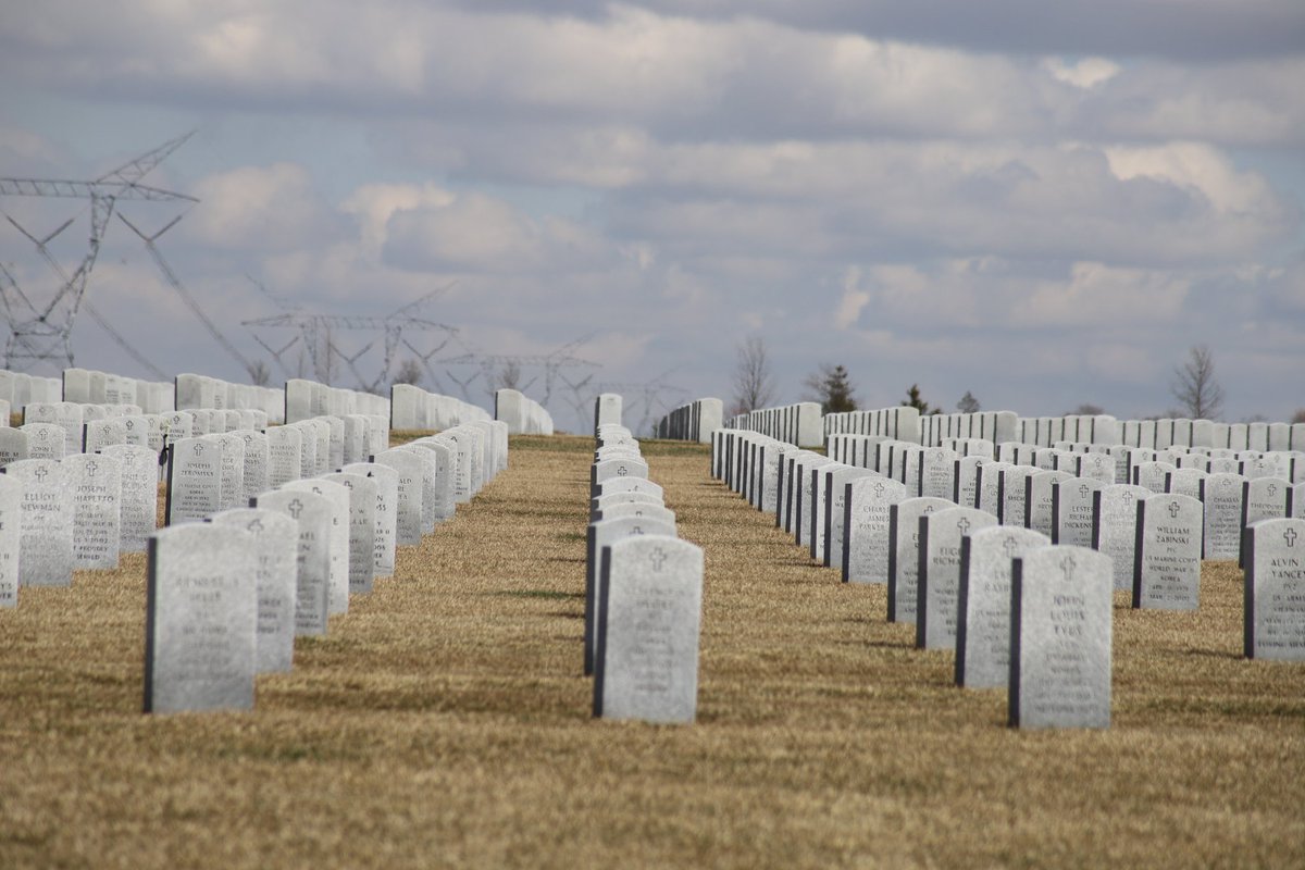 Vast was the only way to describe it. Like when you're driving down state, and all you can see are fields and clouds for as far as you can see. That, but headstones, perfectly aligned, for ages.