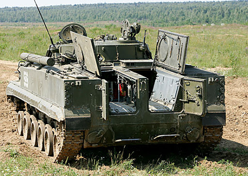 Compare here Bradley (front engine) with BMP-3 (rear engine). Getting out of BMP requires combination of rear and roof hatches to give clearance and climb over engine housing. Could be suggested to be an unacceptable tradeoff. Bradley meanwhile is a standard door and ramp affair