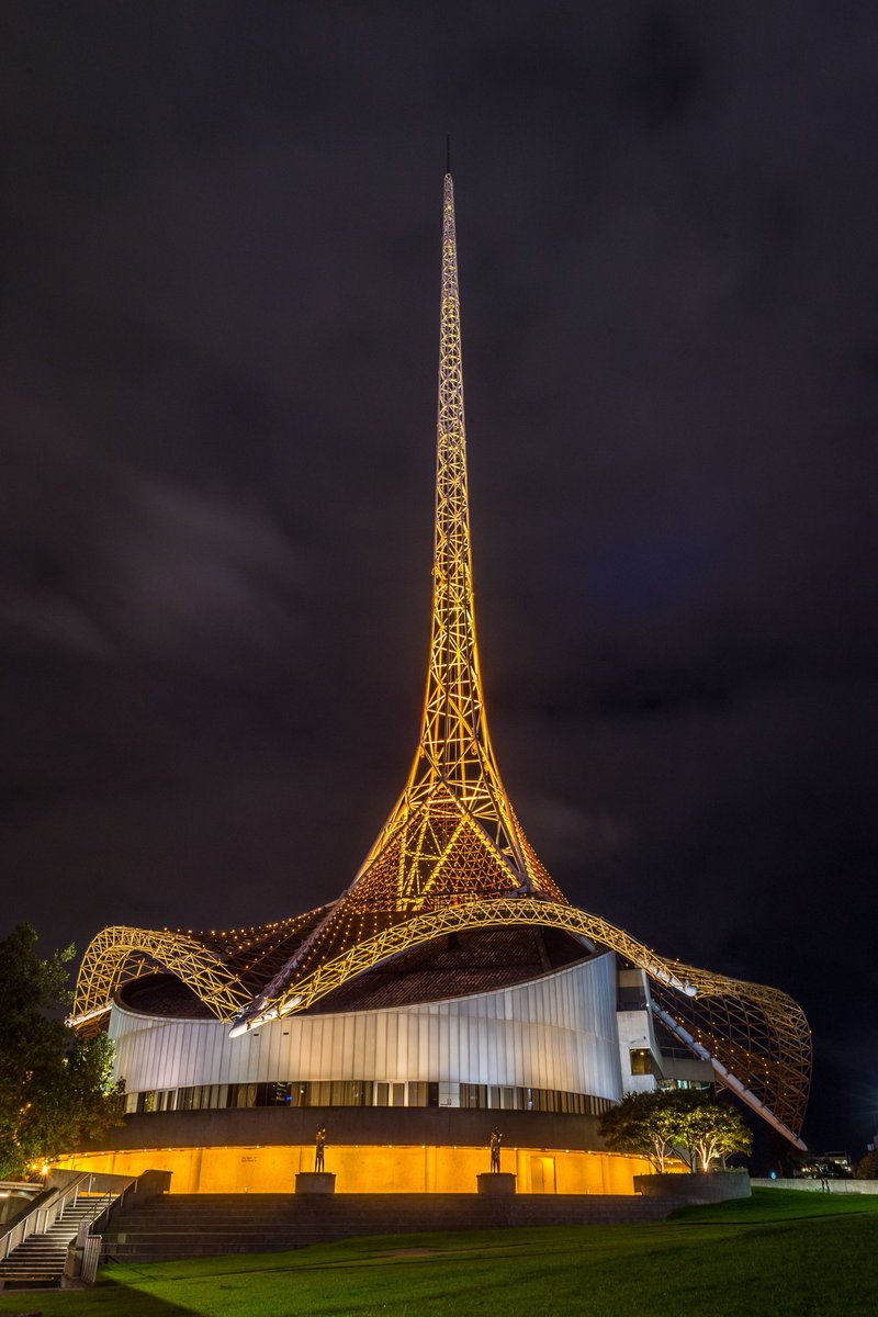artscentremelb's tweet photo. Our iconic Spire is illuminated in yellow, a colour of hope and health, in a show of solidarity with our community and all Victorians during #COVID19. It reflects the theatre tradition of leaving on a single light when they are dark, or closed, to provide safety and security. https://t.co/TRArUrMXN3