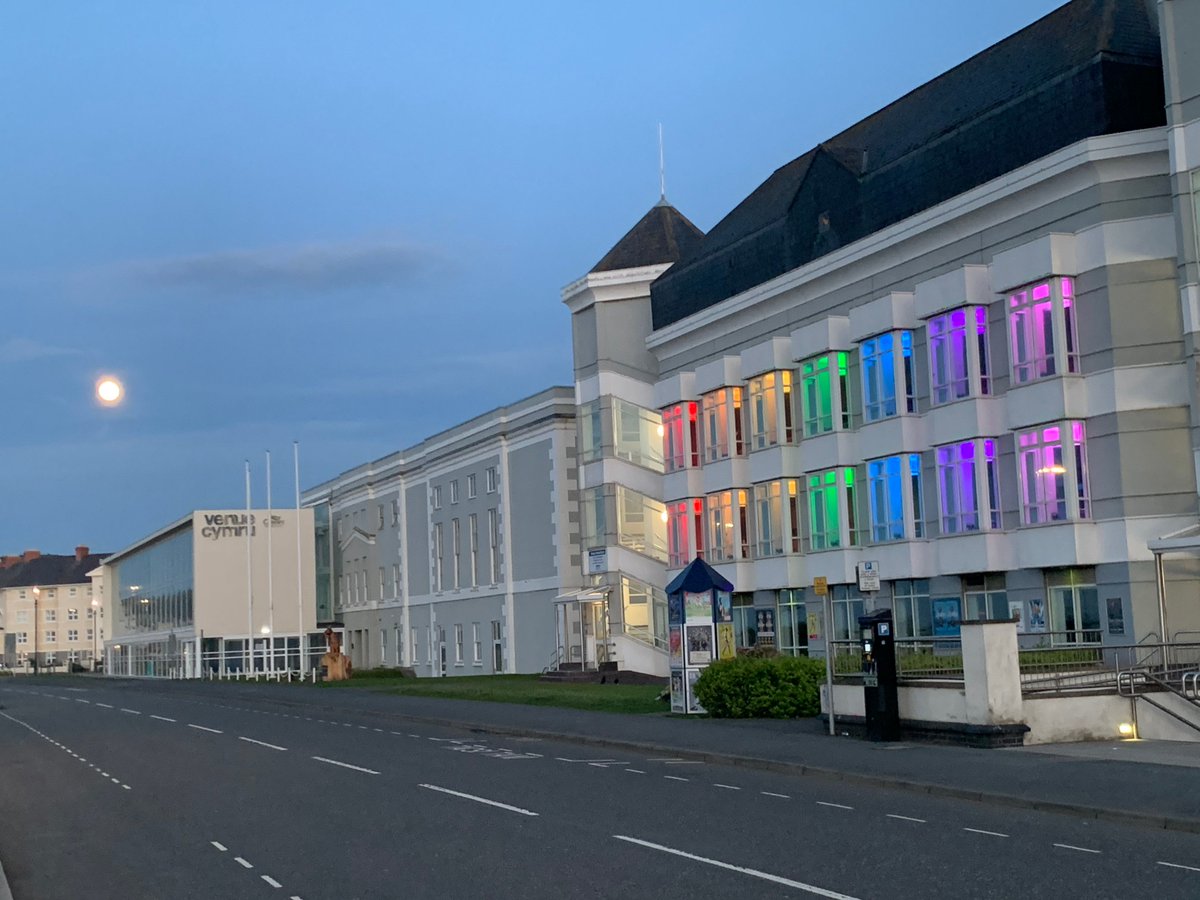VenueCymru's tweet photo. .@venuecymru technicians lit the front of the building with rainbow colours sending out a message of hope to the county and its residents, and our wider communities. The lights will remain on for the duration of Ysbyty Enfys Llandudno. Stay at home / protect the NHS, Save Lives. https://t.co/yYNF9af56p
