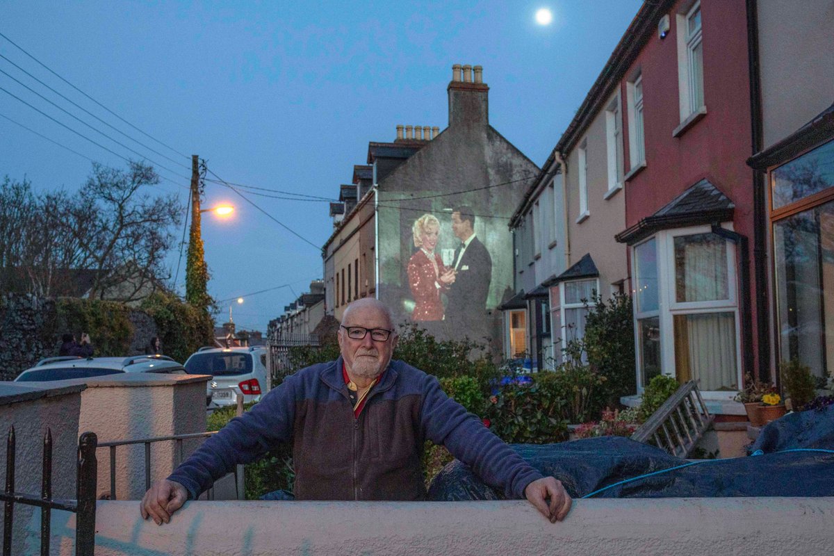 claremkeogh's tweet photo. My neighbour @scottduggan had the most beautiful idea  to project classic movies for our terrace, listening to the movie on an FM signal sitting in our own separate front gardens made us all feel a little less alone :) donations went to @AgeAction https://t.co/8lhEnYW21l