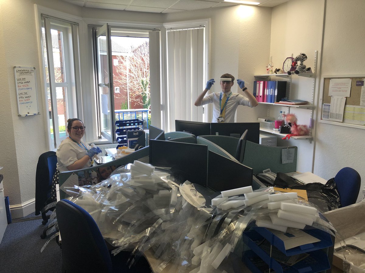 Production line in full flow as executive support team <a href="/nhsswft/">@nhsswft</a> help assemble the visors kindly manufactured and donated by @JLR <a href="/JLR_News/">JLR</a> All helping to keep our staff and patients safe. Thank you 👏