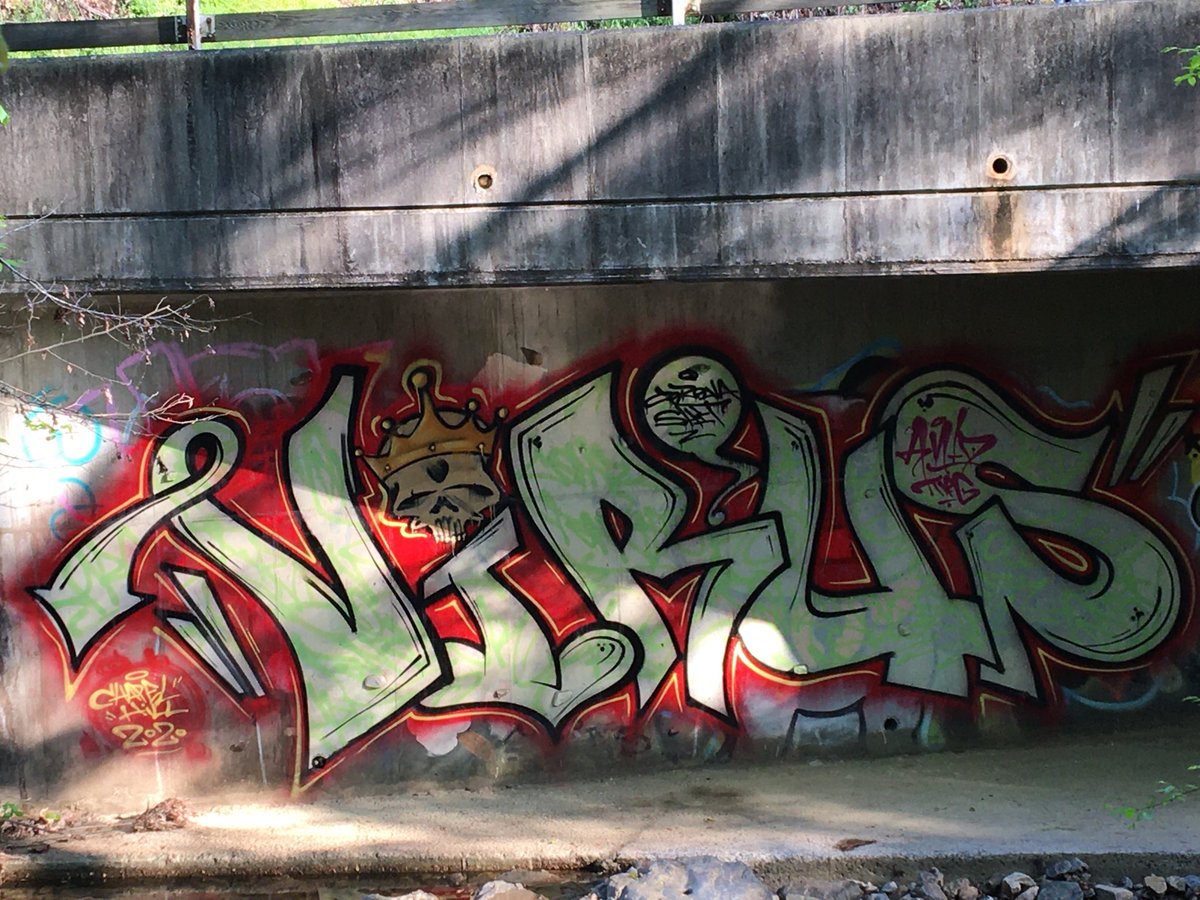 VincentKopp's tweet photo. I’m sure there’s a story behind this graffiti on the wall of a bike path bridge over Bolin Creek in Chapel Hill. I’ll just tag it as #cantstopart. https://t.co/T3Uu2wloXr